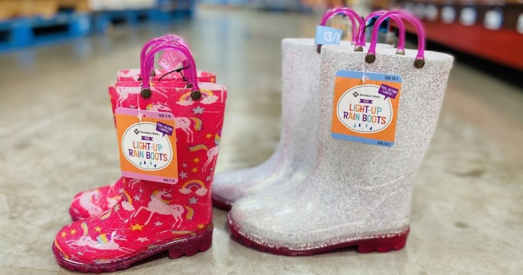 2 pair of kids Members Mark Light-Up Rain Boots on floor in store