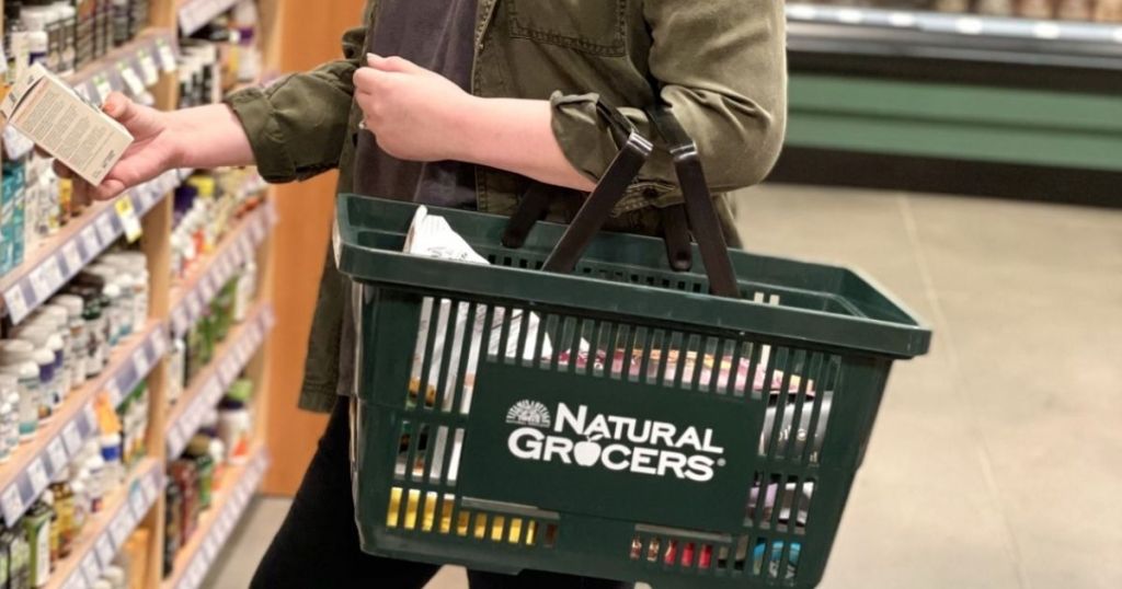 lady with Natural Grocers shopping basket