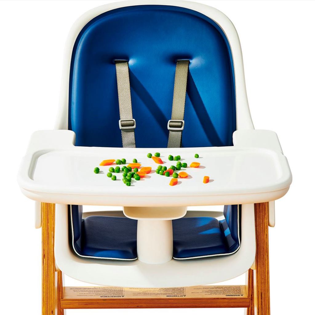 highchair with veggies on the tray