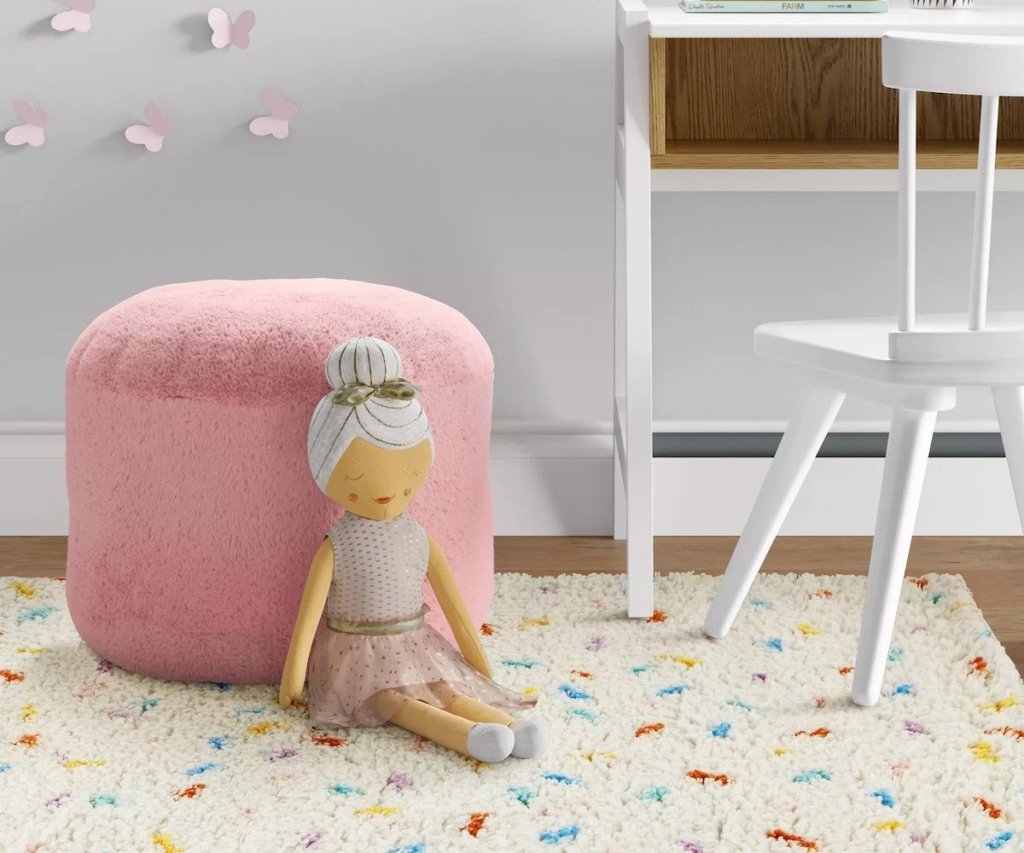 pink pillowfort pouf with ballerina stuffed animal 