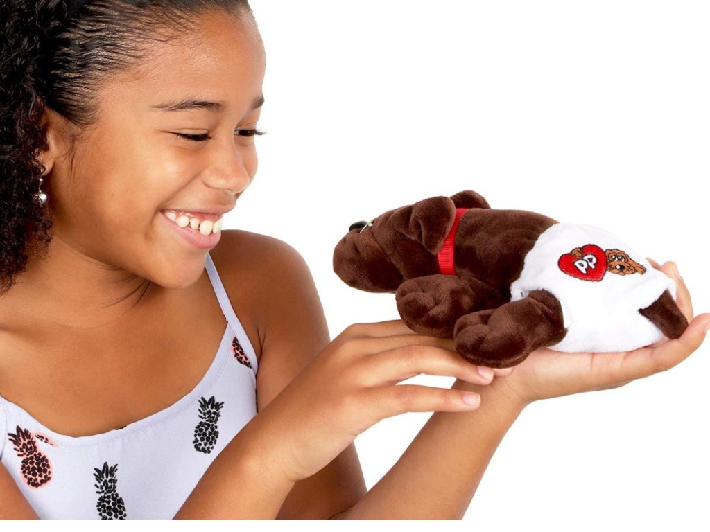 girl playing with a pound puppy