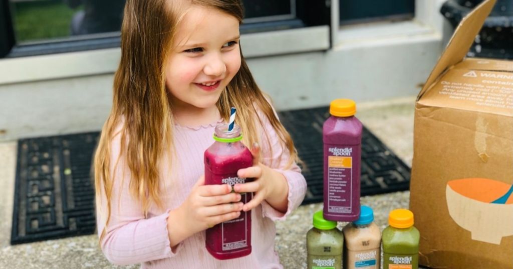 girl drinking a Splendid Spoon smoothie