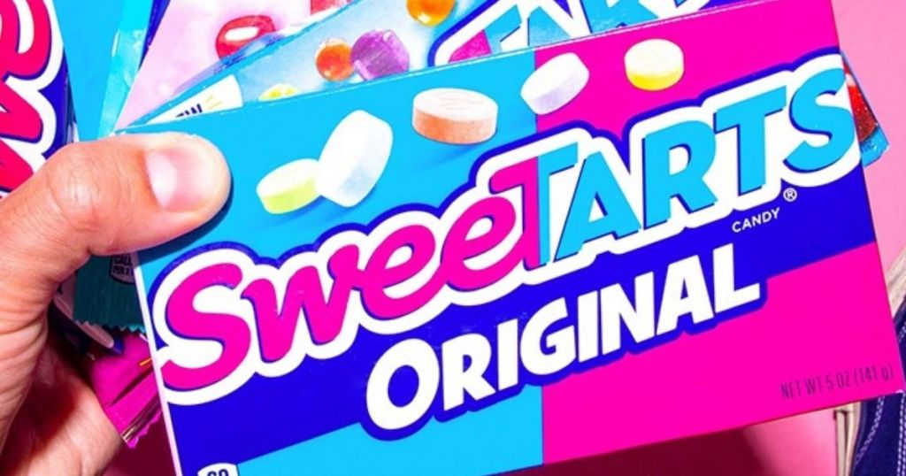 hand holding a box of SweeTarts