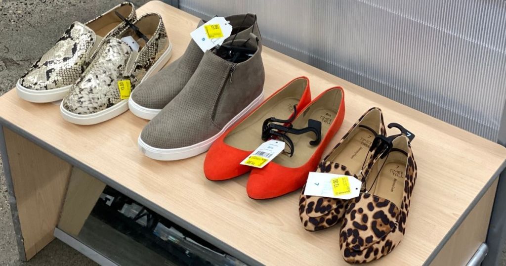 row of shoes on a bench at Walmart