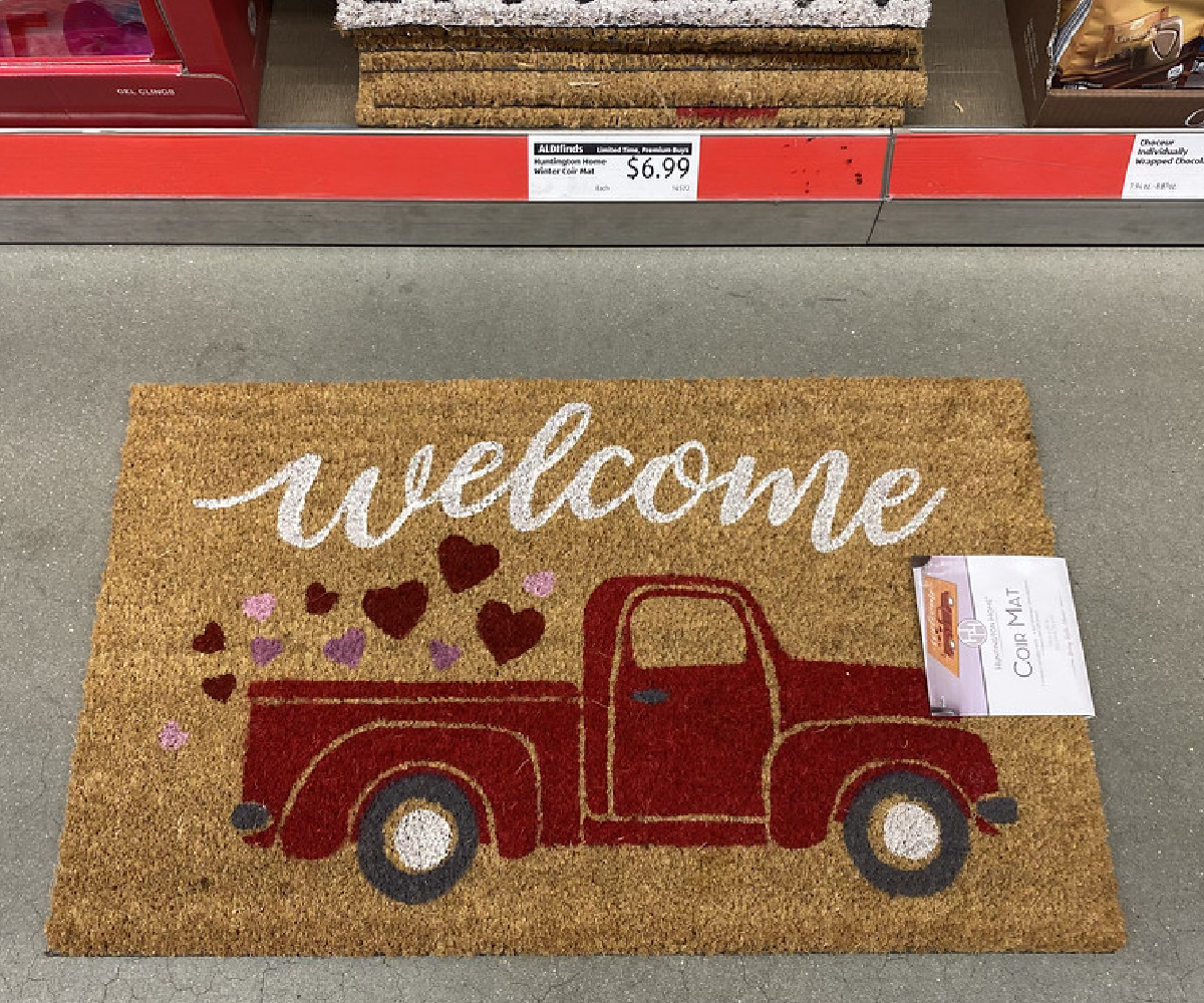 coir welonlinee rug showing a red truck and hearts laying on an aldi store floor