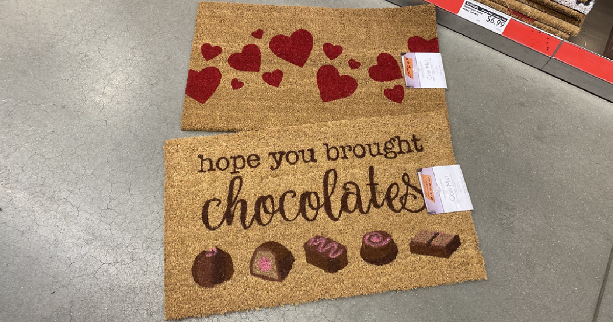 two coir rugs with valentines day designs laying on an aldi floor