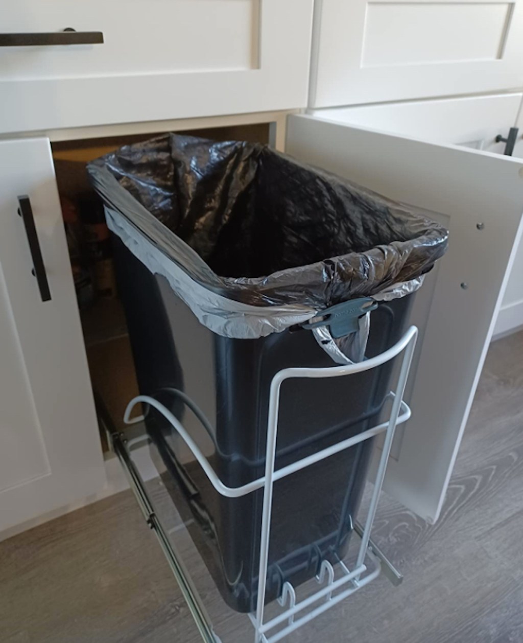 pull out trash can inside cabinet is one of the easy pantry organization ideas