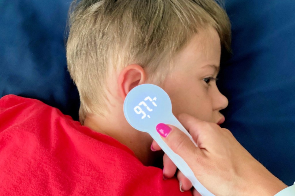 boy with thermometer to ear