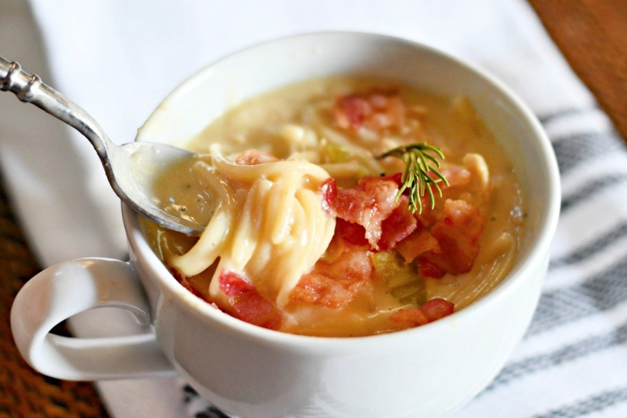 Creamy cheesy chicken noodle soup recipe in a soup bowl