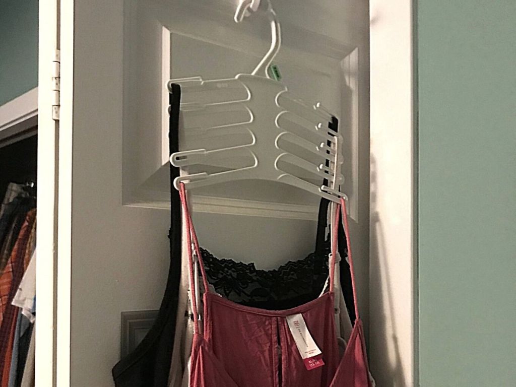 tank tops on hanger on closet door