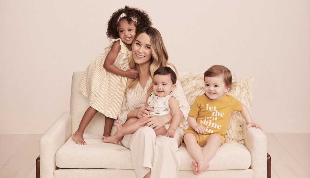 woman sitting on couch with kids