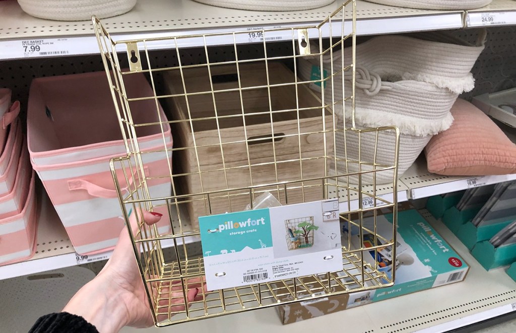 hand holding gold pillowfort storage basket