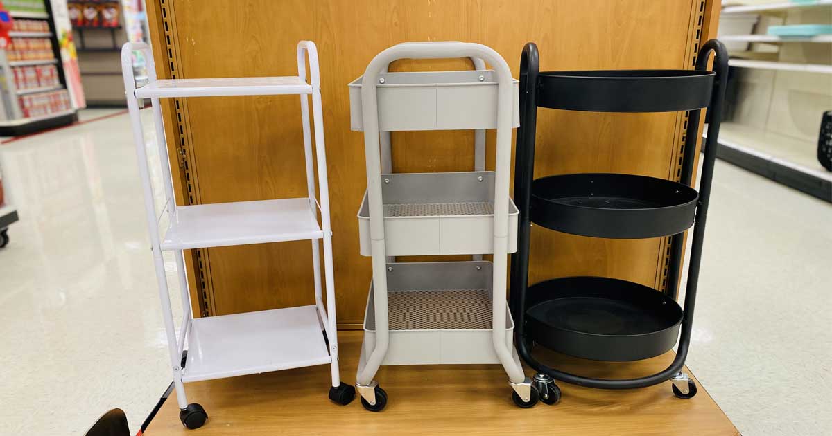 three carts on a shelf in a store