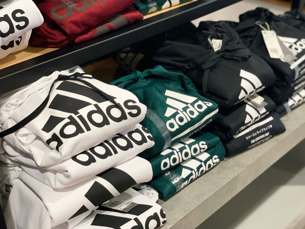 display of folded adidas hoodies