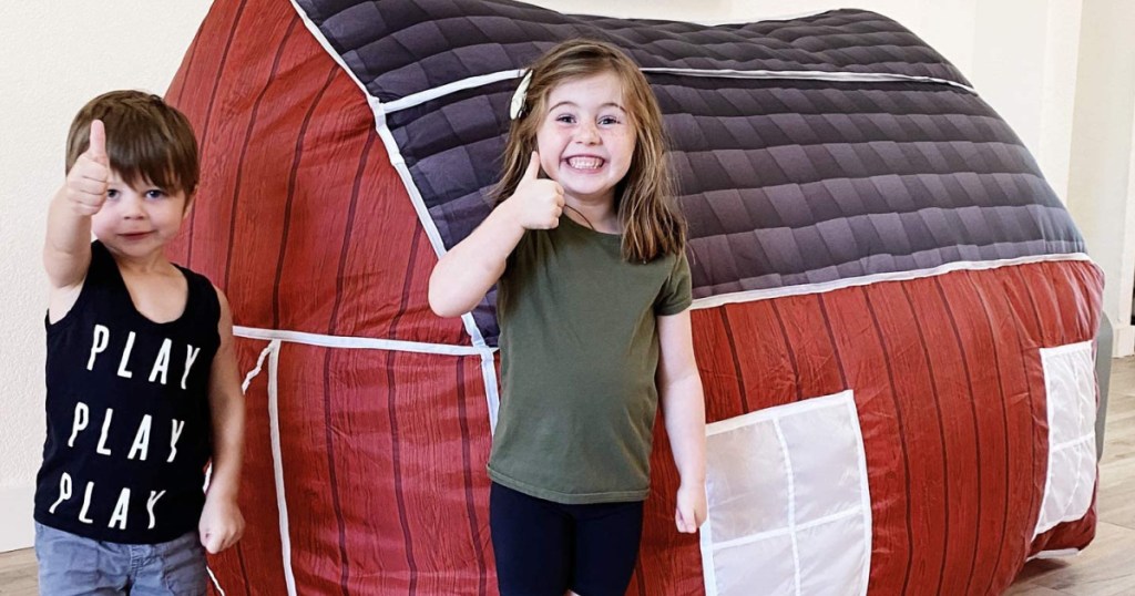 Kids playing near inflatable tent