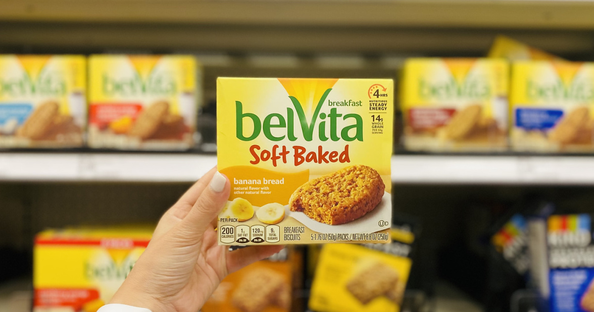 Hand holding up a box of Belvita Soft Baked Biscuits