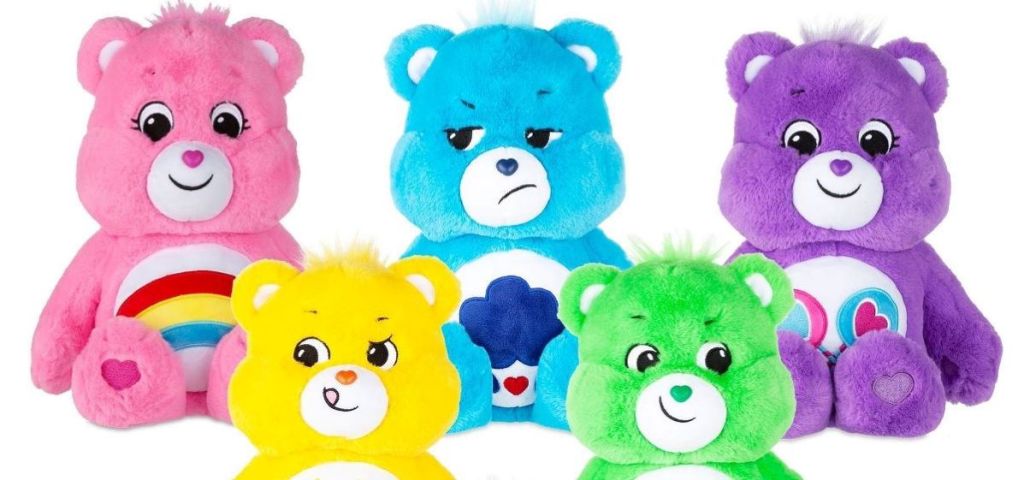 two rows of Care Bears plush toys