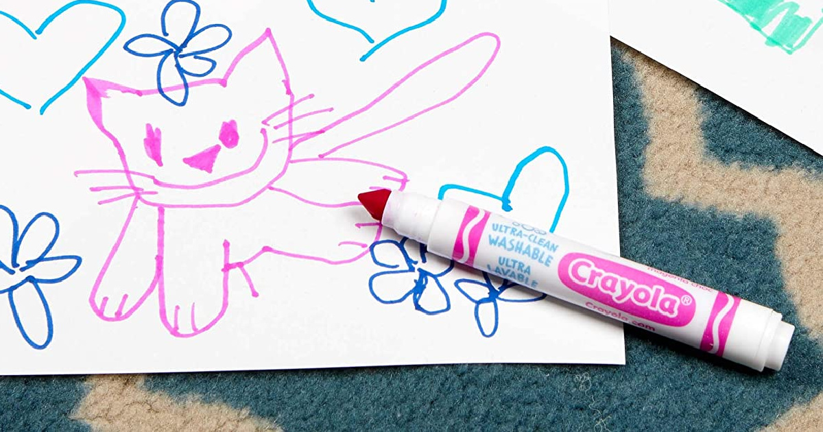 Pink washable marker near a drawing of a cat