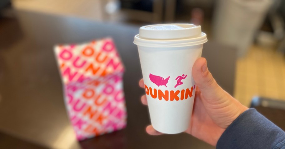 Dunkin Coffee in hand