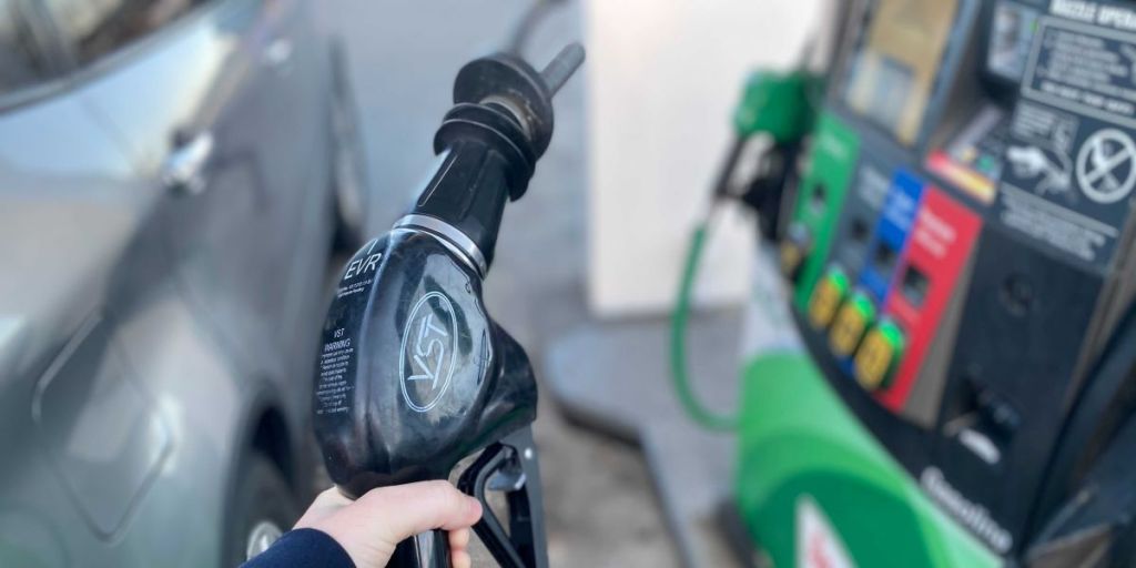 hand holding a gas pump