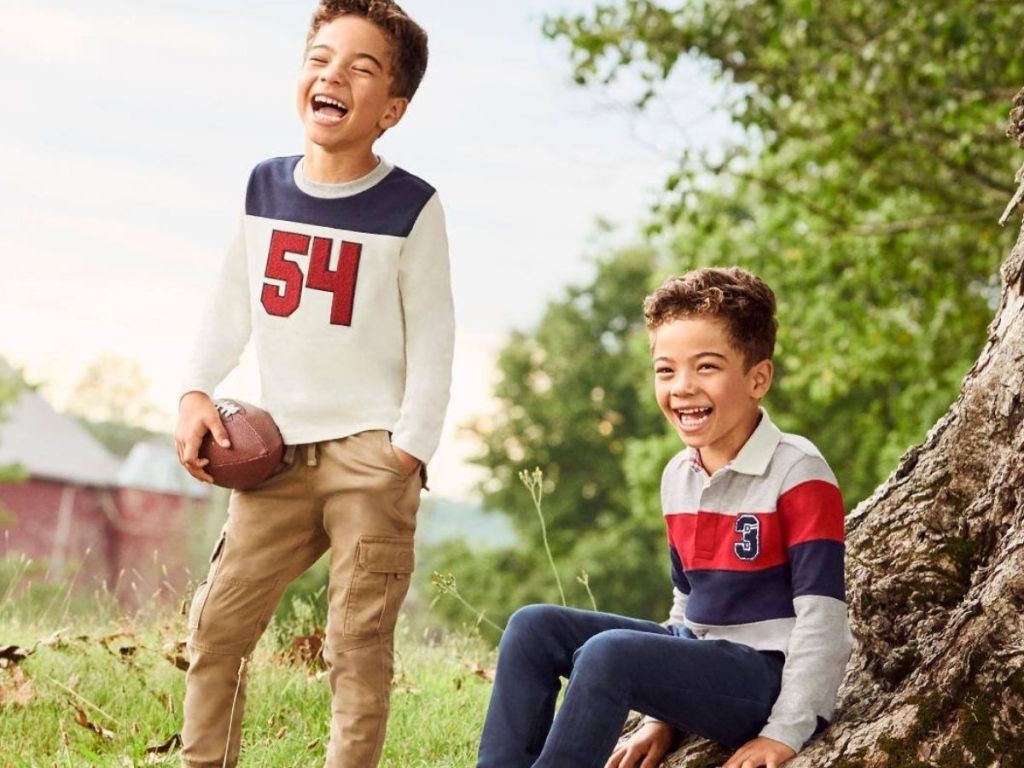 Gymboree Boys wearing football theme clothes