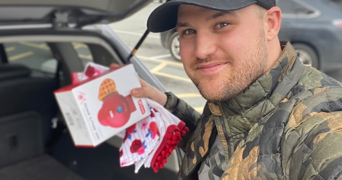 Man grabbing Valentine's Day products from trunk