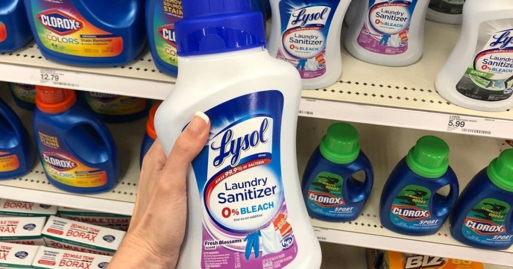 hand holding Lysol Laundry Sanitizer