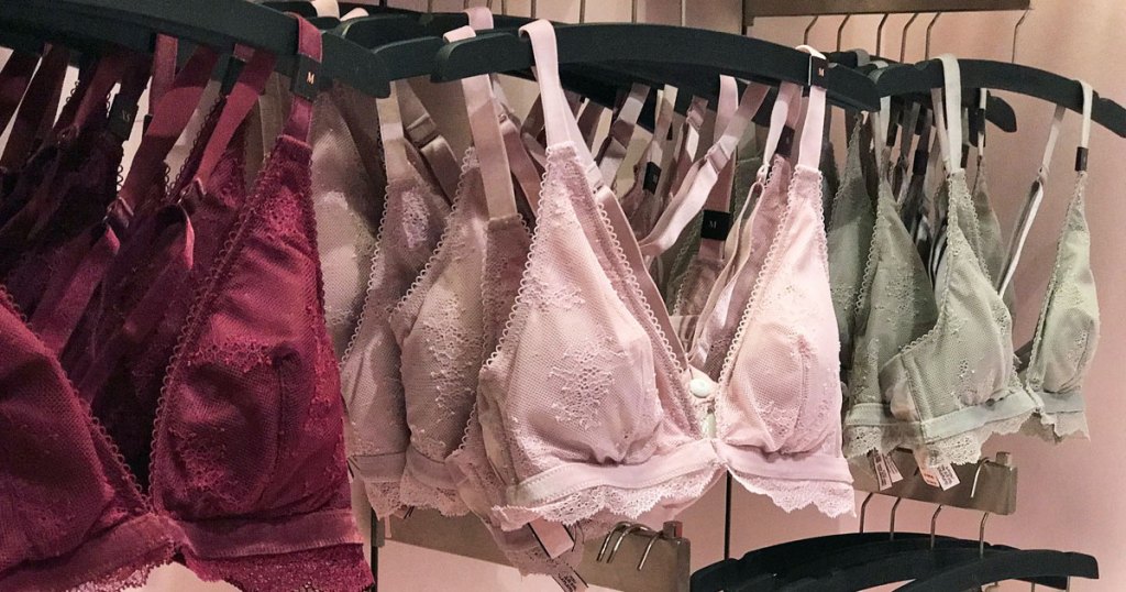 bralettes hanging on hangers at victorias secret