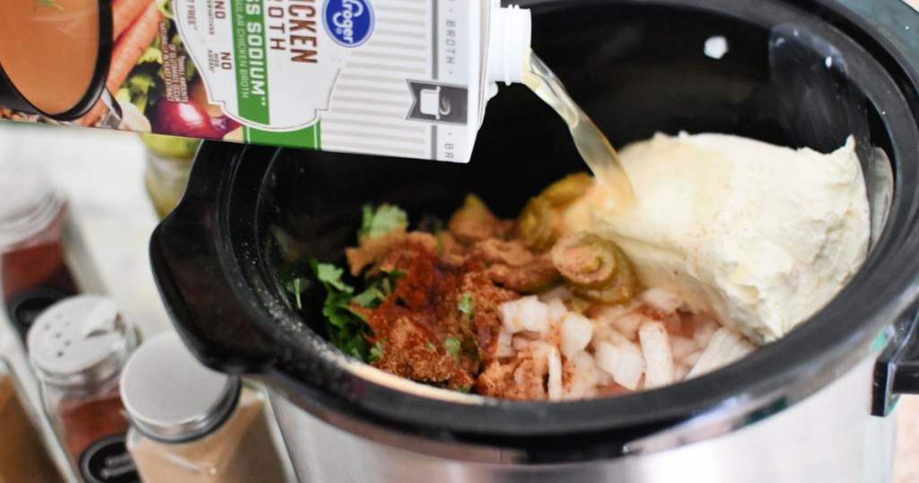 adding chicken broth to slow cooker taquitos