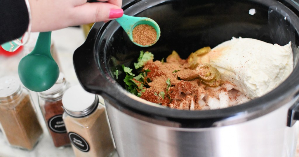 adding seasoning to crock pot