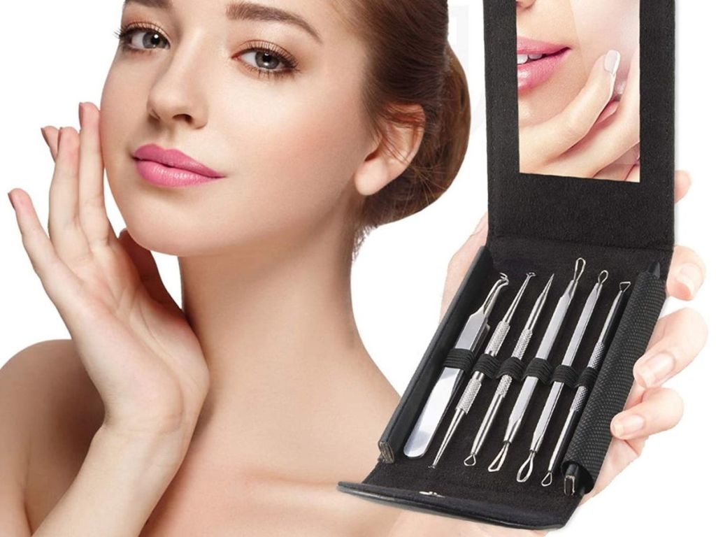 woman holding blackhead kit opened revealing tools and mirror