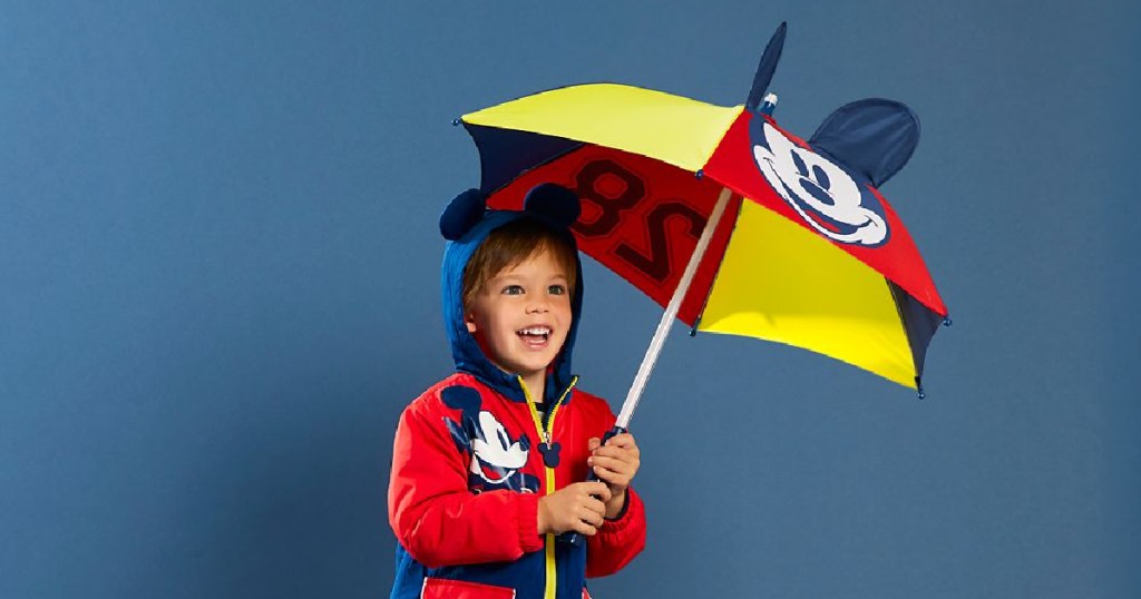 boy holding mickey umbrella