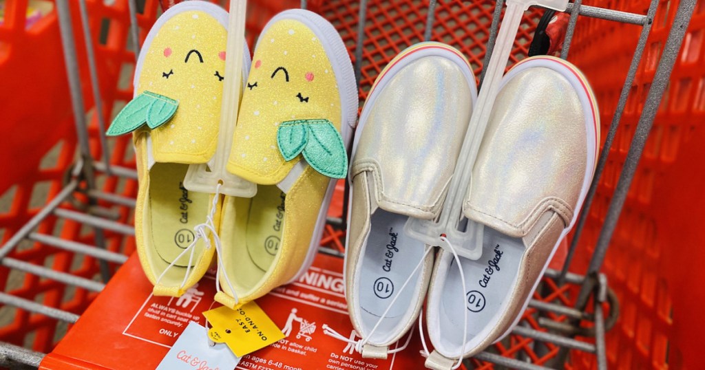 2 pairs of kids shoes in red shopping cart