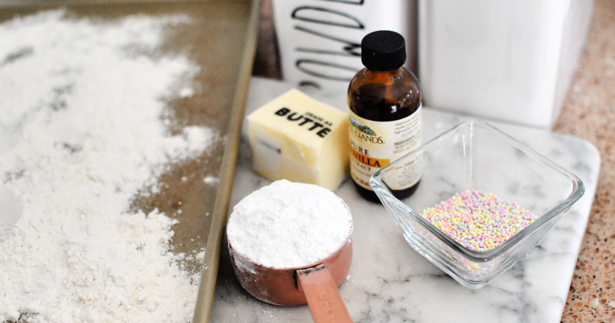 flour, butter, vanilla, and sprinkles on tray