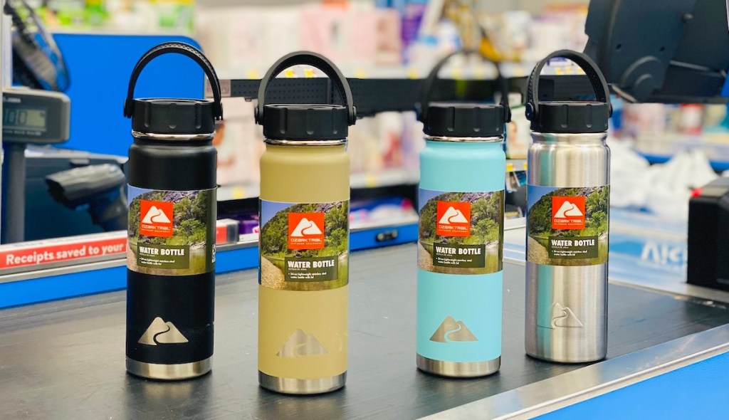 row of different colored ozark trail water bottle