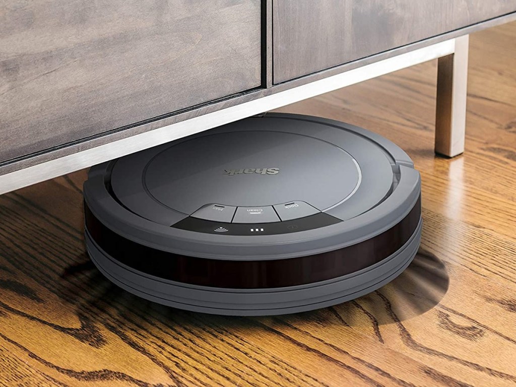 Shark Ion robot vacuum sweeping under couch