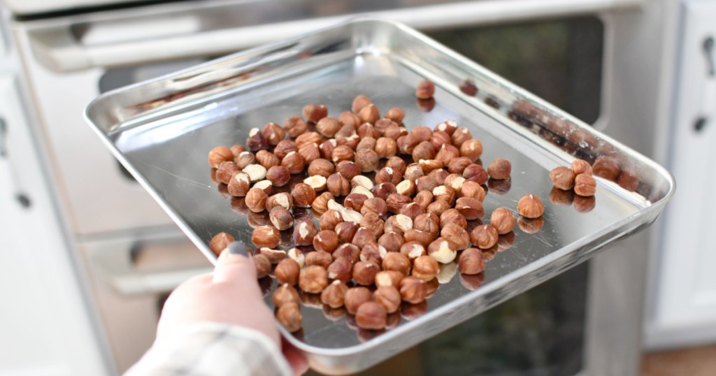 sheet pan of hazelnuts for nutella recipe