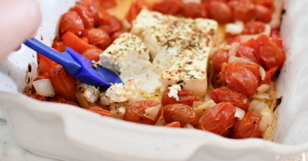 stirring melted feta for tiktok pasta