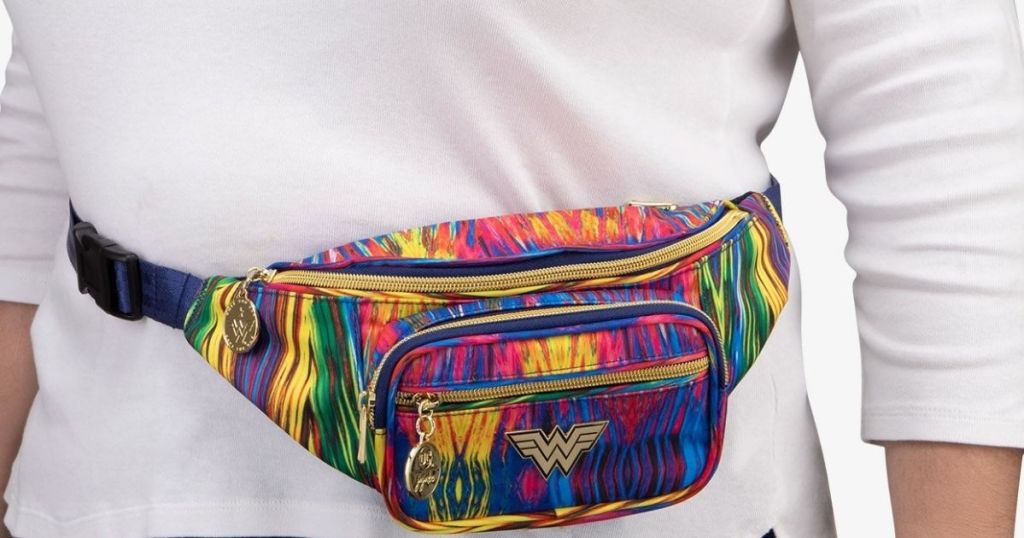 woman in white tee wearing wonder woman waist bag