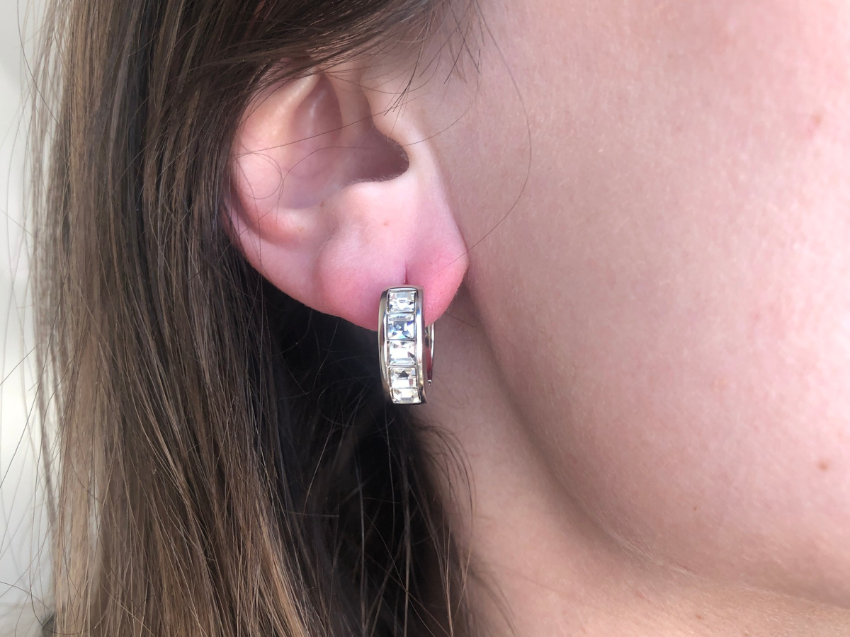 women wearing silver plated hoop earrings