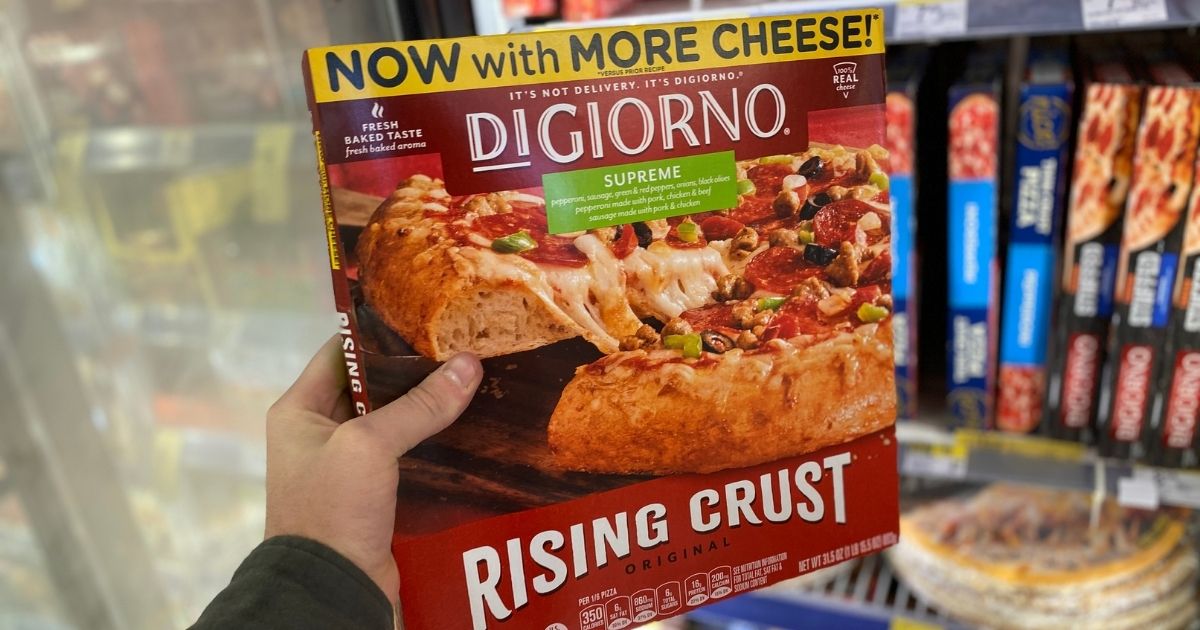 hand holding a DiGiorno pizza