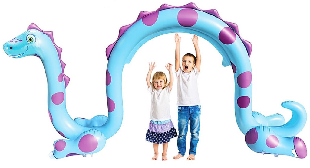 kids standing under a dinosaur shaped sprinkler