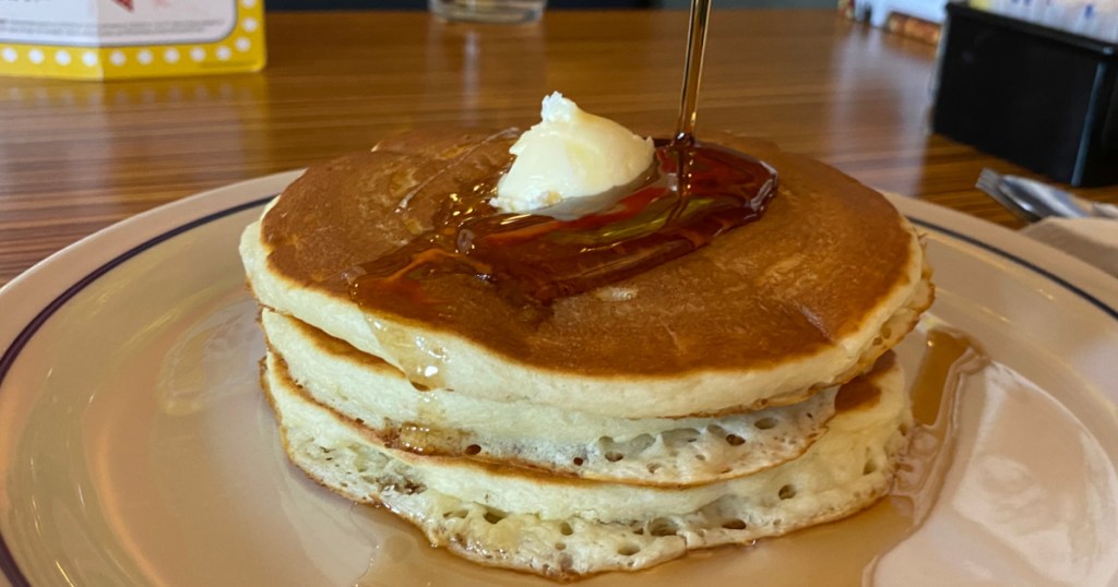 stack of pancakes on plate in restaurant