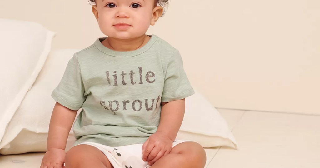 baby boy in green graphic tee