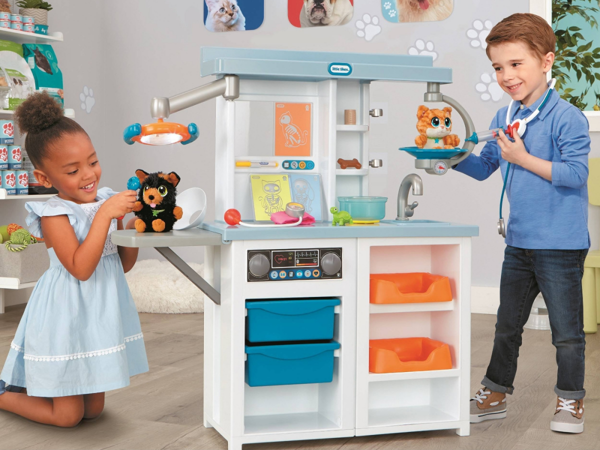 boy and girl playing with vet playset