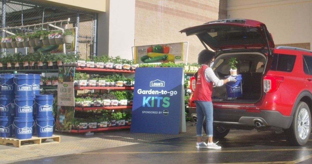 lowes employee loading garden kit into car