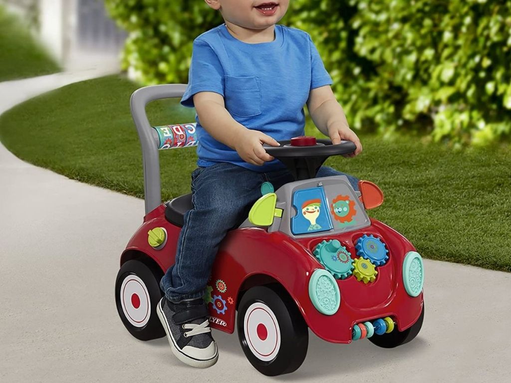 little boy on Radio Flyer Busy Buggy