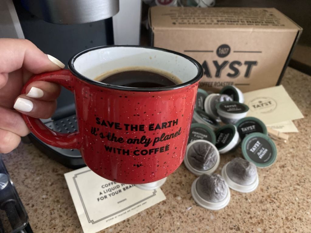 hand holding a coffee mug