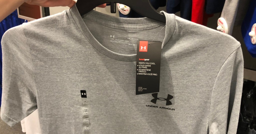 hand holding a men's grey under armour t shirt