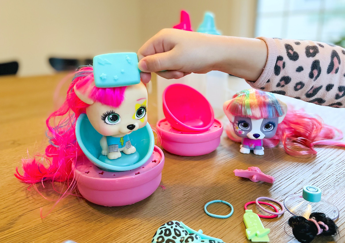 hand brushing vip pet dolls hair on table